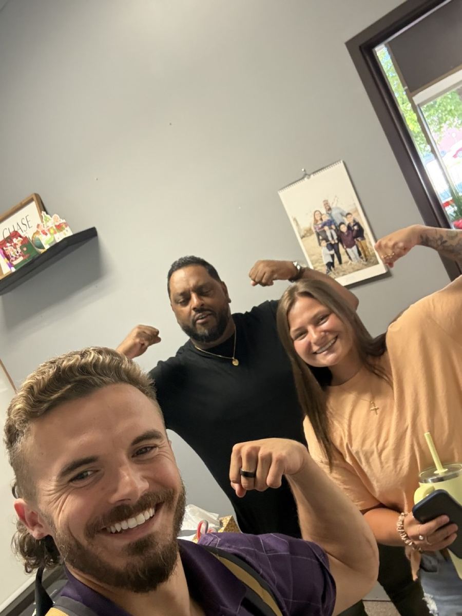 Andrew, Morgan and a client flexing for a selfie