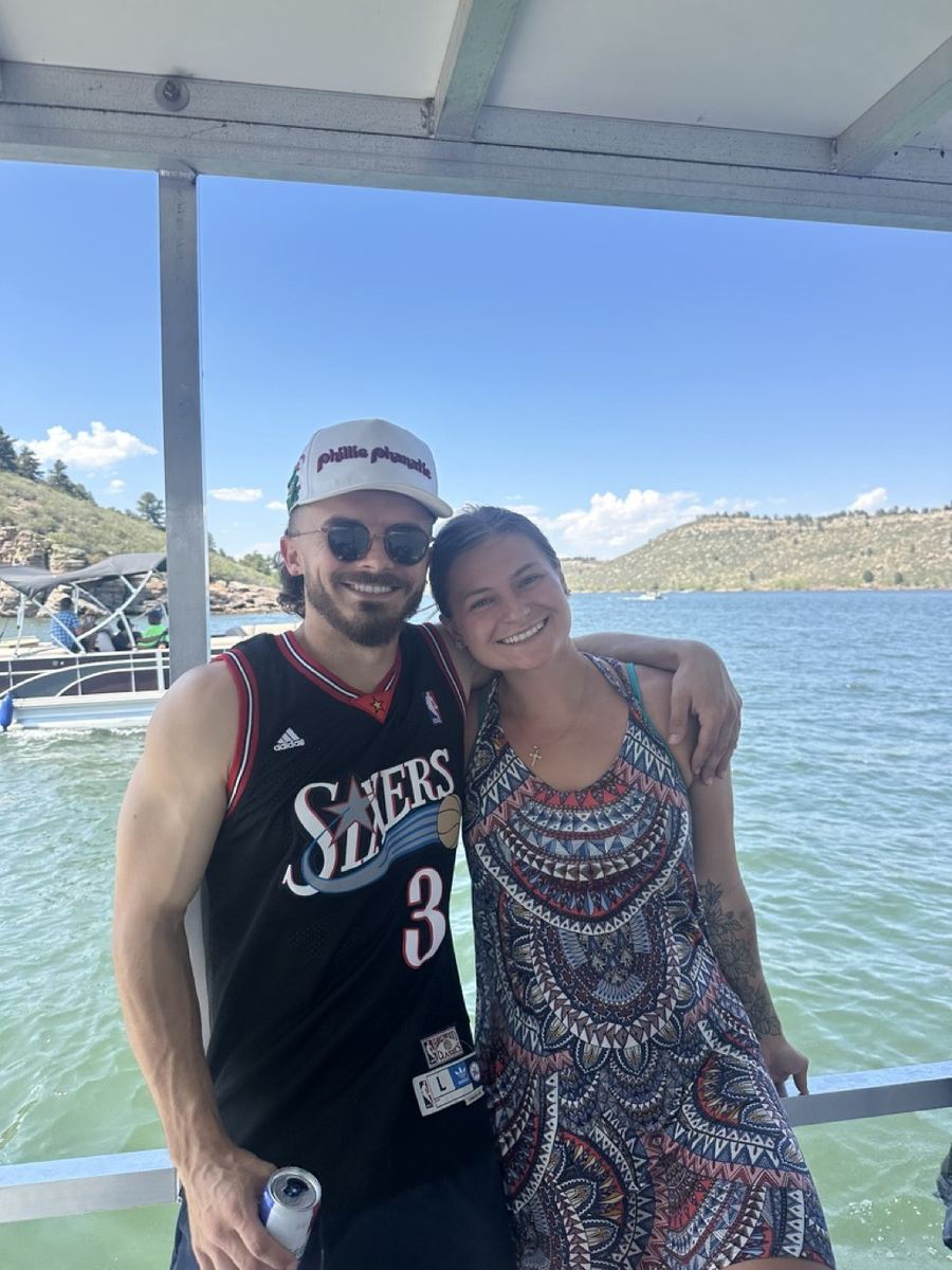 Andrew and Morgan on a boat at the lake